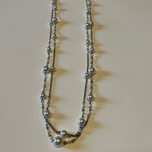 Double strand 24 inch silver colored and pearl like necklace